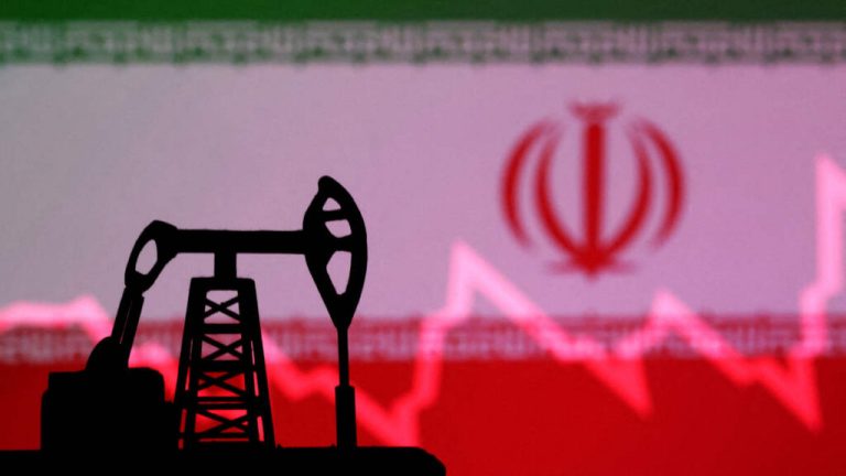FILE PHOTO: Illustration shows Iran flag, oil pump jack and stock graph